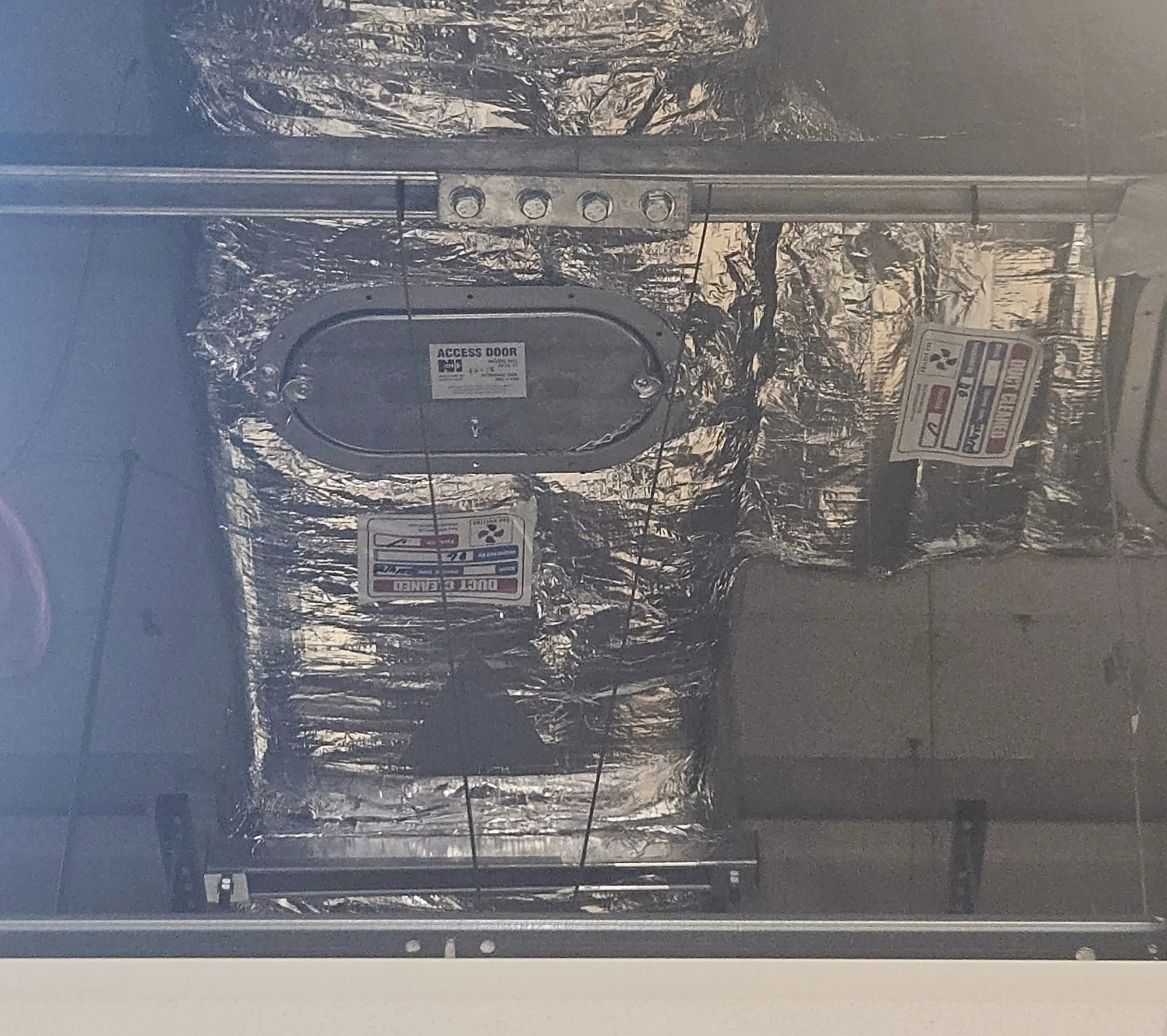 Insulated ductwork with a labelled access door